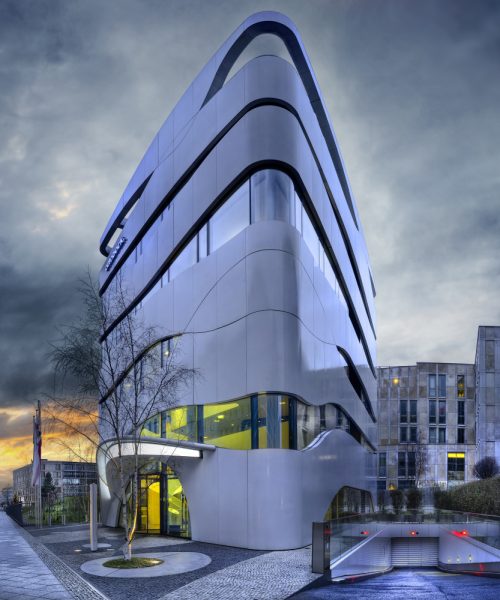 facade-modern-building-with-geometric-windows-curved-walls